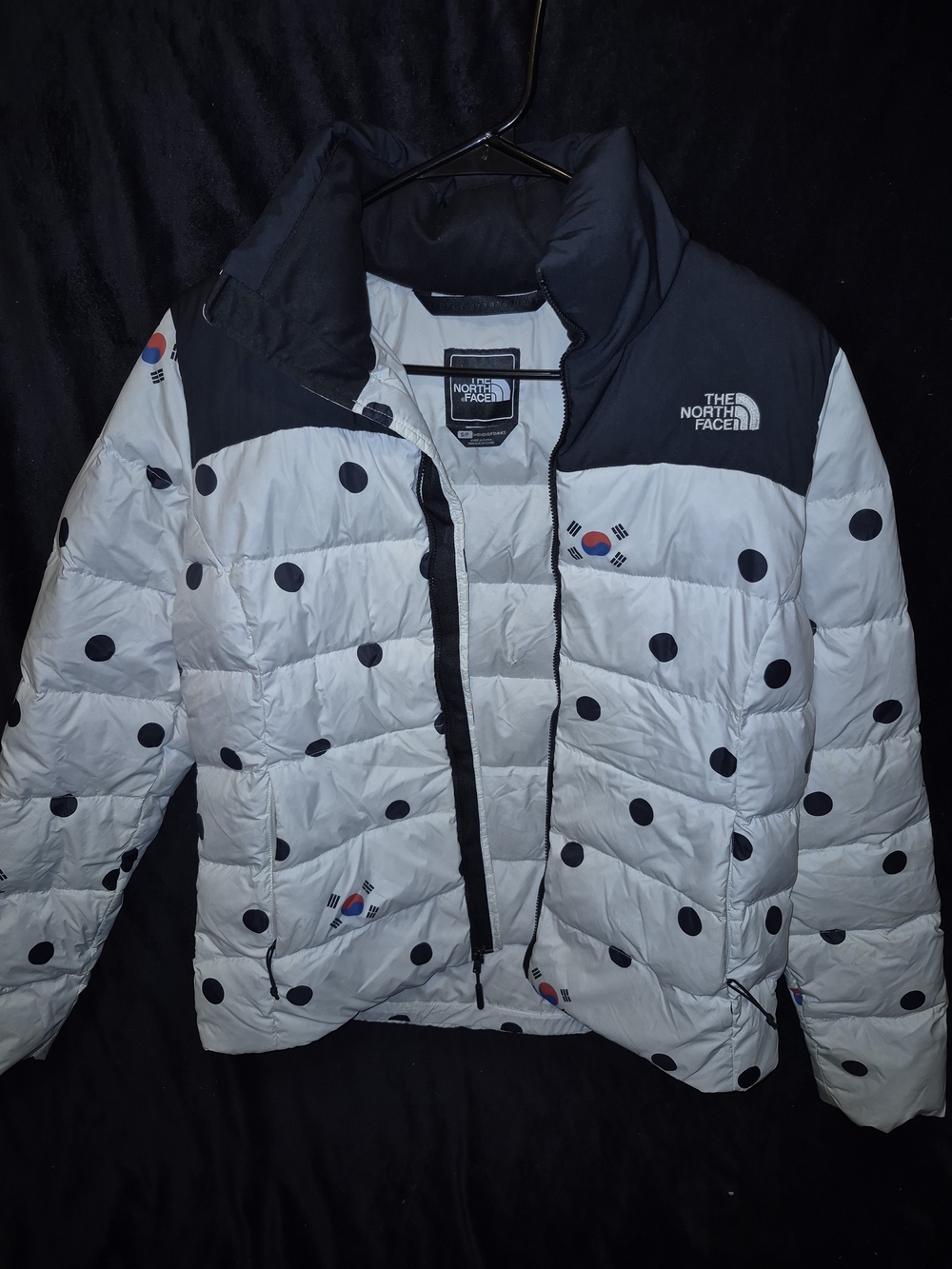 The North Face Kids' White Puffer Jacket with Black Polka Dots